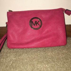 Lightly used pink {Micheal Kors} wristlet
